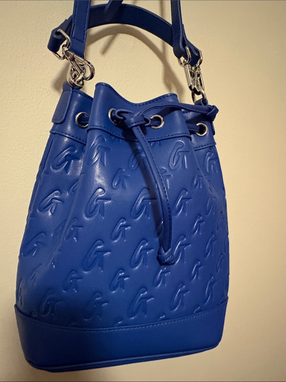Embossed G Blue Drawstring Bucket Crossbody Bag